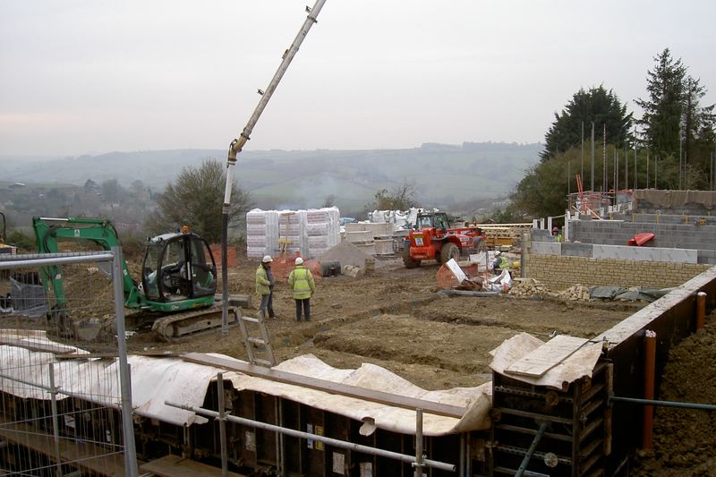 Concrete pouring into the footings